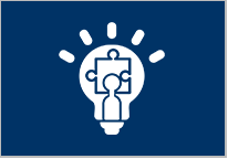 A blue and white icon of a light bulb with a puzzle piece on it.